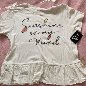 White T-shirt with saying on it.